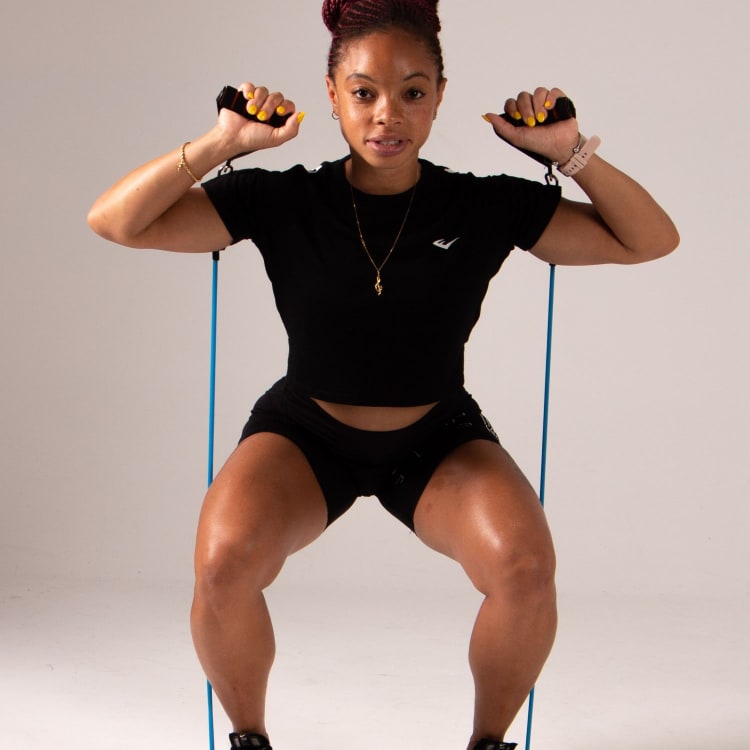 a woman performing the squat exercise